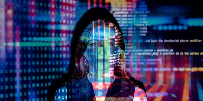 Women with data projected in light across her